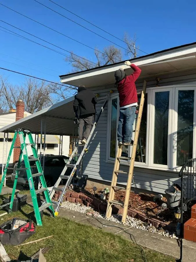 Restoration crew performing exterior repair in Palmer Town